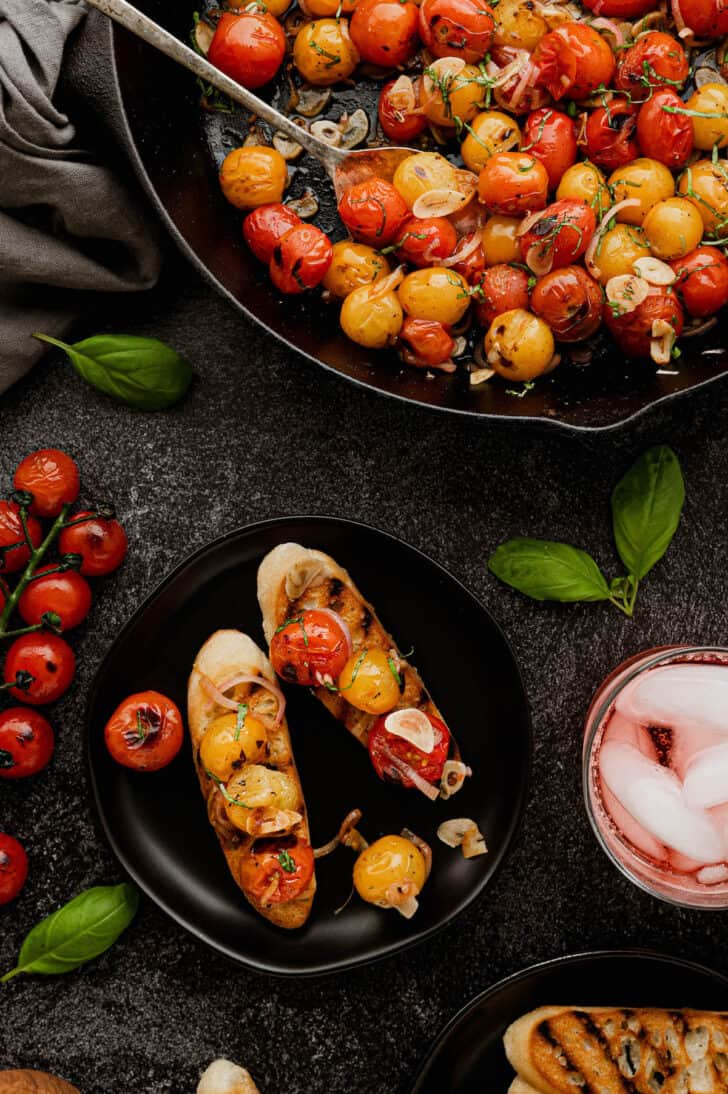 Cooked summer fruit and shallots and garlic served on toasted bread.