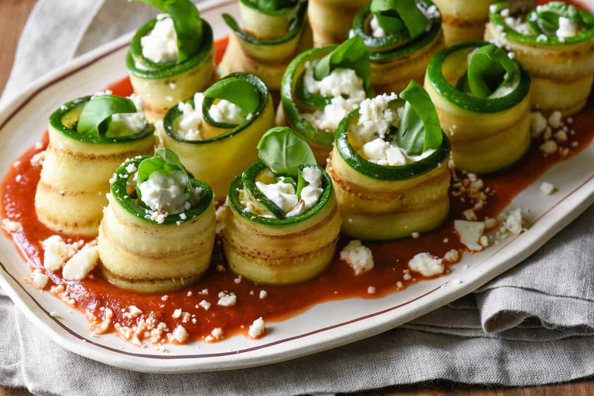 Use your grill to prepare these easy but elegant Grilled Zucchini Roll Ups with Feta. Serve as a party appetizer, a vegetable side dish, or even a light summer meal. | foxeslovelemons.com